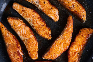 Salmon fillets in the frying pan