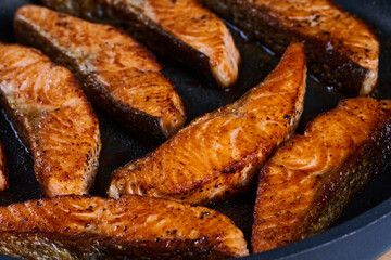 Salmon fillets in the frying pan