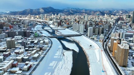 Sapporo in winter, city in Hokkaido, Japan, aerial view of snowy cityscape of Sapporo, tourism in northern Japan