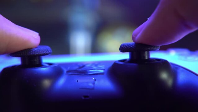 Gamer playing game with controller
