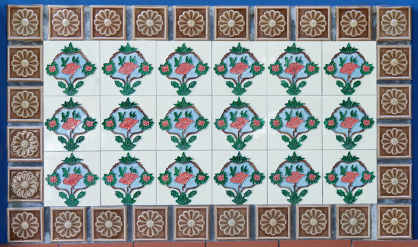 Rows Of Antique Nyonya Tiles With Colourful Flowers. Vintage Wall Tile In Penang.