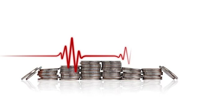A pile of coins and a heartbeat graphic. Concept of economic crisis management.
