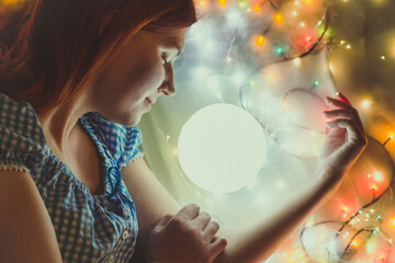 Naklejka premium Close up pretty sleeping woman with round lamp portrait picture. Closeup side view photography with fairy lights on background. High quality photo for ads, travel blog, magazine, article