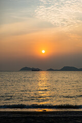 warm orange sunset and cloud over the sea, ocean and beach