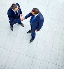 Top view, business people or handshake in modern office, finance company or investment startup for...