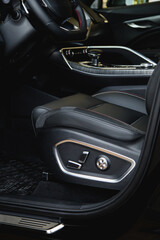 Fototapeta na wymiar Door seat adjust button switch control in luxury business car