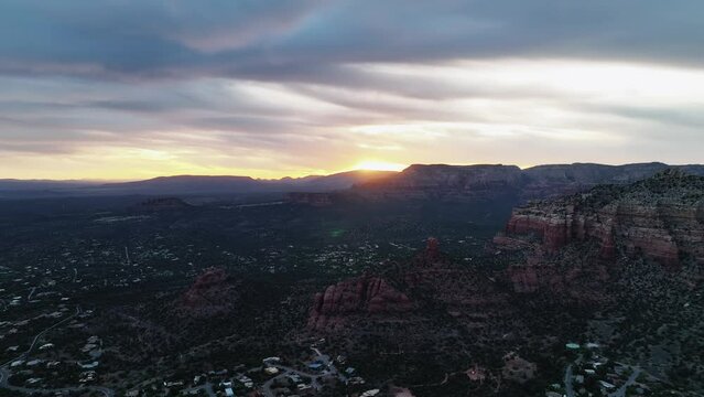 Panorama Of Sedona Downtown With Red Canyons During Sunset In Arizona, United States. Aerial Shot