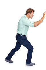 Naklejka premium Man, pushing and obstacle or frame in struggle against a white studio background. Isolated casual male walking to push heavy weight or shield using physical effort with expression or gesture