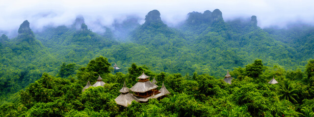 Fototapeta premium Rain forest scene with hidden mountaintop temple, misty mountains, panoramic landscape, generative AI