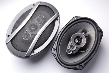Black car sound speakers close-up on a white background, audio system, hard bass subwoofer