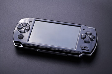 Hybrid handheld portable video game console with switch detachable controllers on both sides...
