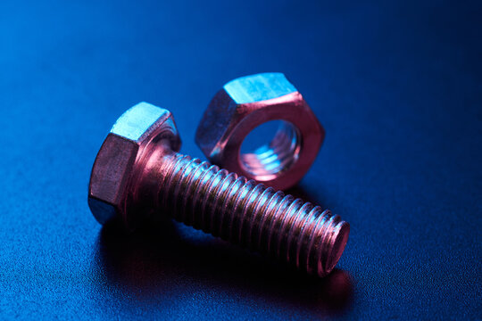 Set of bolts nuts nails metal fasteners. Consumable hardware tools. assortment steel screws collection close up background