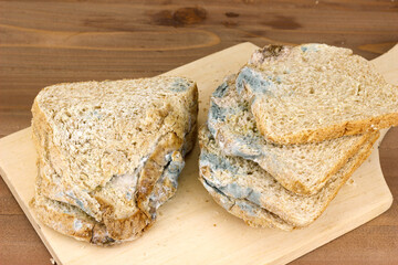 Close-up of Moldy bread on cutting board
