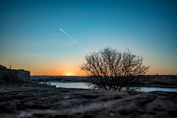 Blue hour scenery landscape, Valletta, Malta, airplane trail in the cloudless sky