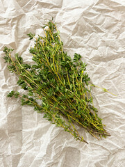 Green thyme bunch. Bundle of fresh thymes on baking paper