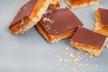 Rustic style millionaires’ shortbread blocks with crumbs