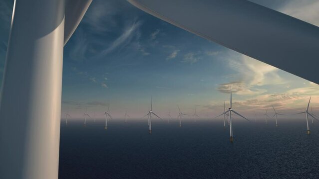 An offshore windpark at the ocean in daylight with a bright sun camera animation from bottom to top of a white windmill with a view to the horizon. Many windmills in the background.