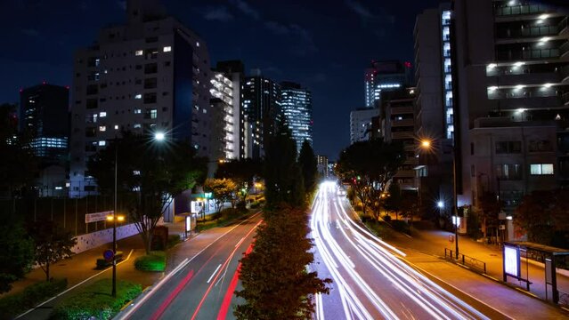 A night timelapse of the traffic jam at the city crossing in Tokyo wide shot