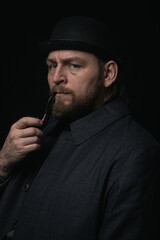 stylish man in retro outfit suit hat smoking wooden pipe sherlock holmes look cosplay england gentleman fashionable confident gangster Guy Ritchie Charlie Hunnam style