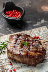 filet Mignon beef steak on a wooden board. banner, menu, recipe place for text, top view