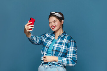 Happy Woman Making Selfie Smartphone. Plus Size Girl Smiling And Winking While Videocalling Cellphone, Shooting Content For Social Media, Enjoying Mobile