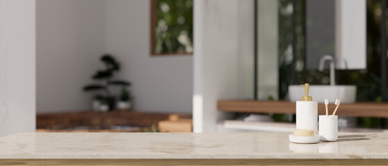 Luxury marble tabletop with bath accessories and copy space over blurred bathroom background
