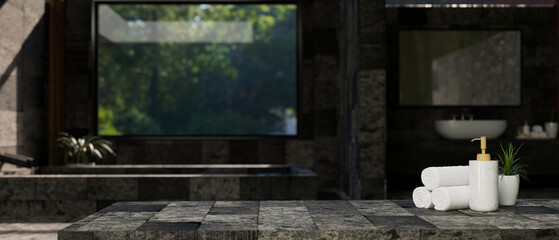 Fototapeta na wymiar Copy space on stylish stone tabletop over blurred background of luxury stone bathroom design