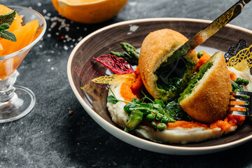 Chicken Kiev, breaded chicken breast stuffed with herbs and butter. cutlet breast with mashed potatoes and pumpkin. top view