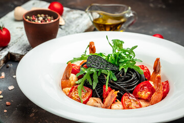 black pasta with shrimp and cherry tomatoes. Delicious balanced food concept, banner, menu, recipe place for text, top view
