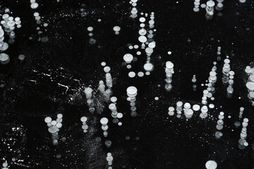 Frosty patterns on the ice . crystal structure. Winter fairy background