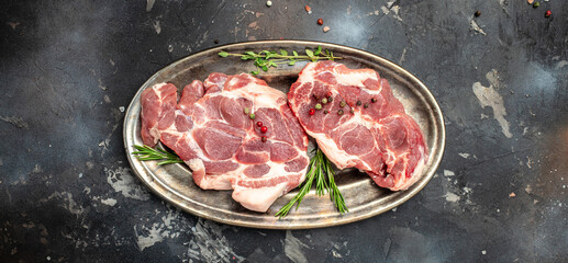 meat, Raw meat pork steaks with seasoning. Long banner format. top view