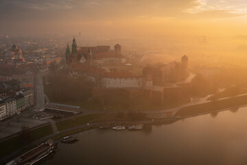 Naklejka premium Foggy sunrise at Wawel Castle in Krakow. Poland