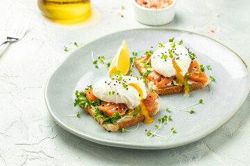 Toast with salmon, poached egg and avocado guacamole, Ketogenic diet. Low carb high fat breakfast. Healthy food concept. place for text, top view
