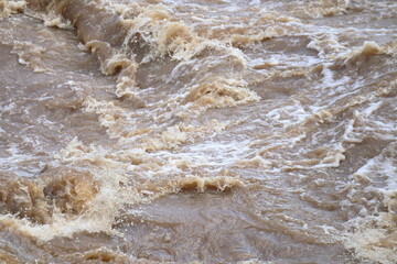 Fototapeta na wymiar Brown water is seen in Piracicaba river, after heavy rains in Sao Paulo state, Brazil.