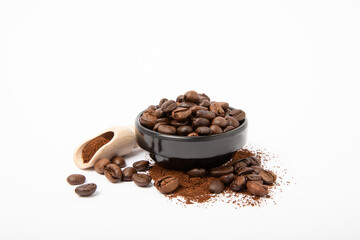 Ground coffee and beans in a bowl and loose isolated on a white background.