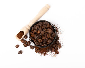 Ground coffee and beans in a bowl and loose isolated on a white background.