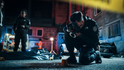 Asian Policeman Taking Pictures of Marked Evidence While Police Female Chief and Detective Talk...