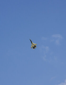 MAKS-2011 on territory of airfield LII im. Gromov. MAKS-2011. Russian multi-role fighter Su-35 (NATO - Flanker-E) performs vertical climb flight. Close-up. Zhukovsky, Russia - August 16, 2011