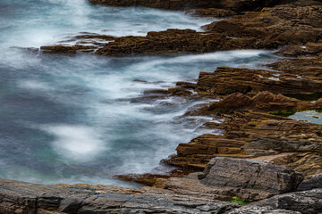 Waves at the cliffs at the coast of ireland
