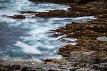 Waves at the cliffs at the coast of ireland