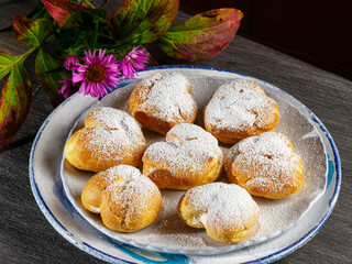 Delicious heart shaped profiteroles filled with cream dessert