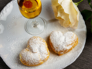 Delicious heart shaped profiteroles filled with cream dessert