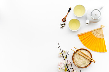 Asian tabble set with tan and teapot, top view