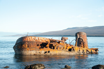 Fototapeta na wymiar Shipwreck rusted with view on Isle of Jura