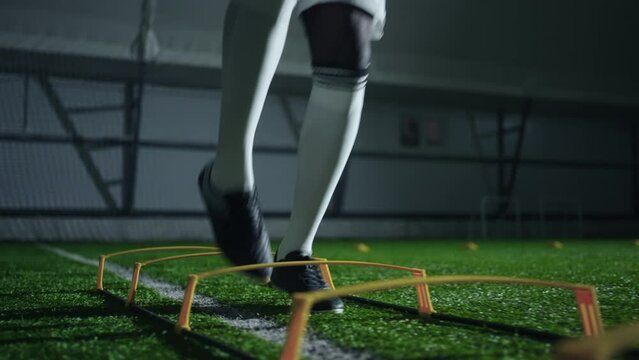 exercise in football training, professional soccer player training alone, closeup of feet, running