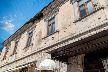 Bullet holes in a facade of one building, Mostar, Bosnia and Herzegovina. War Memory