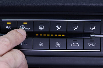 Windshield Defogger Icon on Car. Hand pressing the defogger button to remove the fog on the...