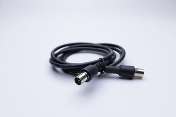 Black coax cable on white background