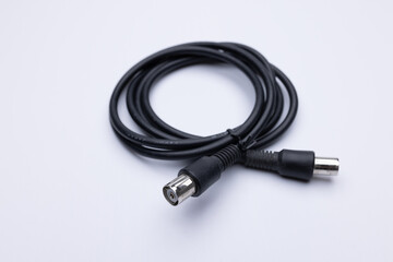 Black coax cable on white background