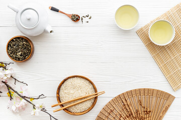 Asian tabble setting with tea set and rice bowl
